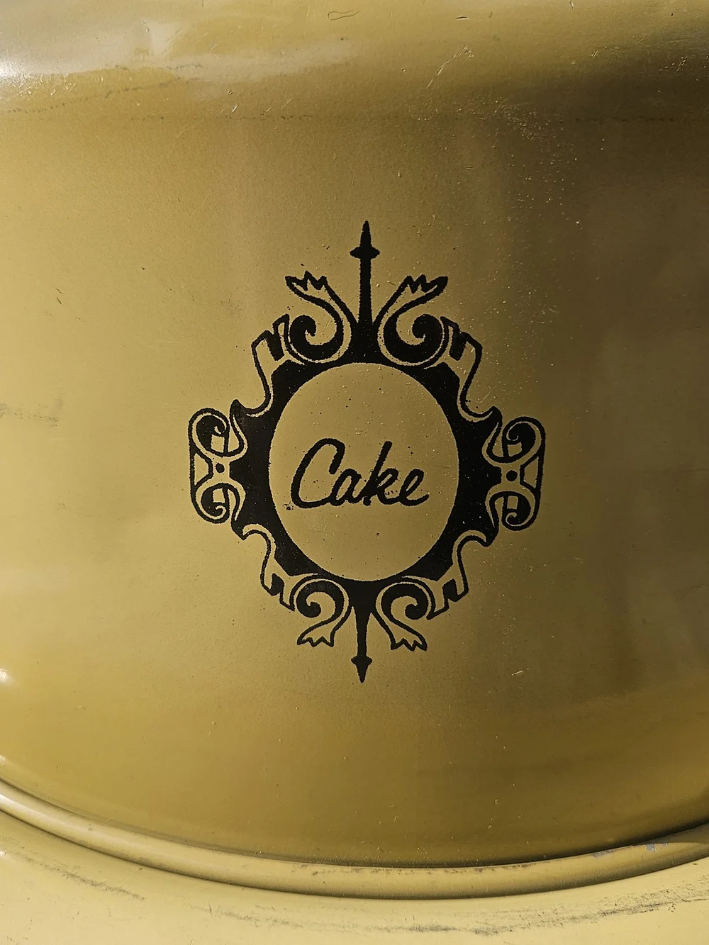 Yellow Cake Keeper with Decorative Emblem